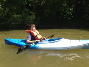 Our nephew Isaac kayaking along the Harpeth River.