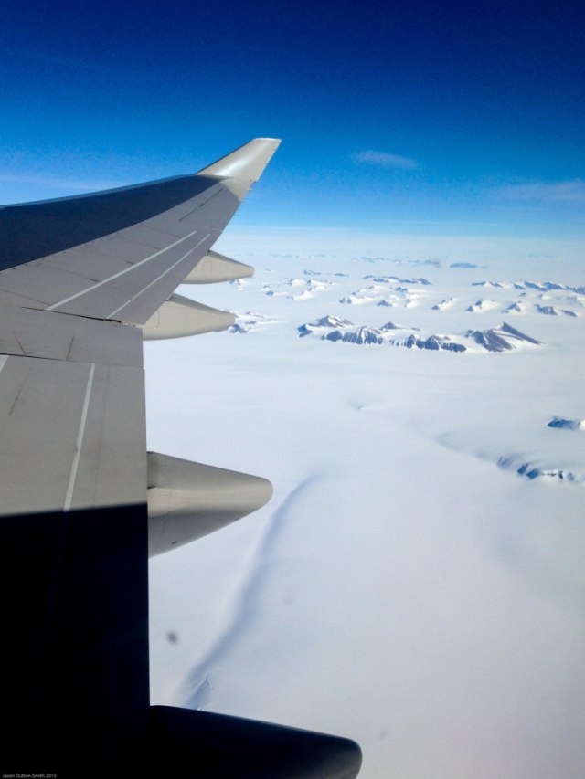 Antarctic mountains peering through the dense snow and ice.