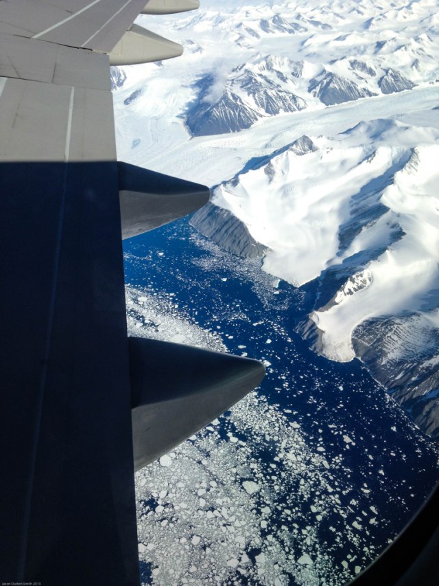Antarctic mountain ranges meeting the ocean.